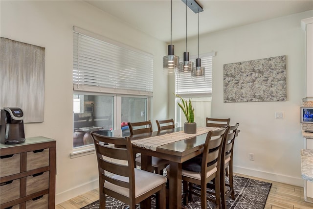 dining area with light hardwood / wood-style floors