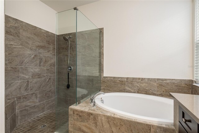 bathroom with vanity and plus walk in shower