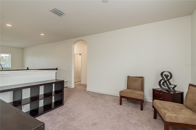 bedroom featuring light colored carpet