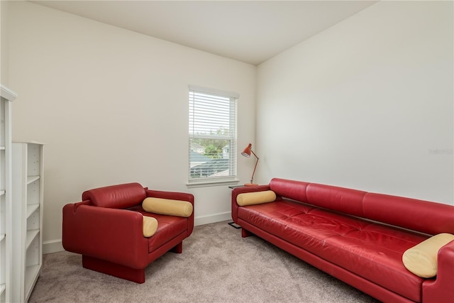 sitting room featuring light colored carpet