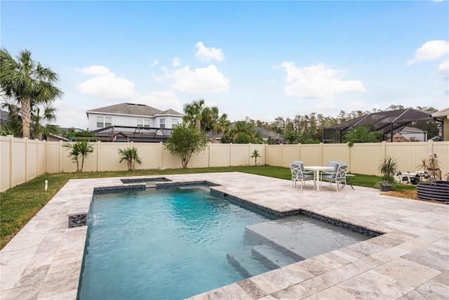 view of swimming pool with a patio area and an in ground hot tub