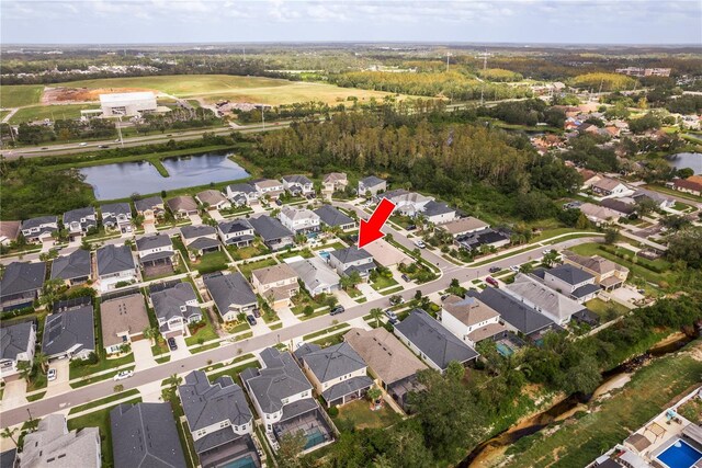 birds eye view of property featuring a water view