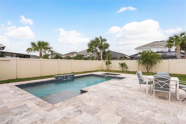 view of swimming pool with a patio and an in ground hot tub