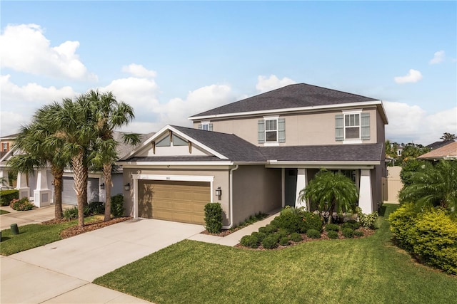 view of front of home with a garage and a front yard