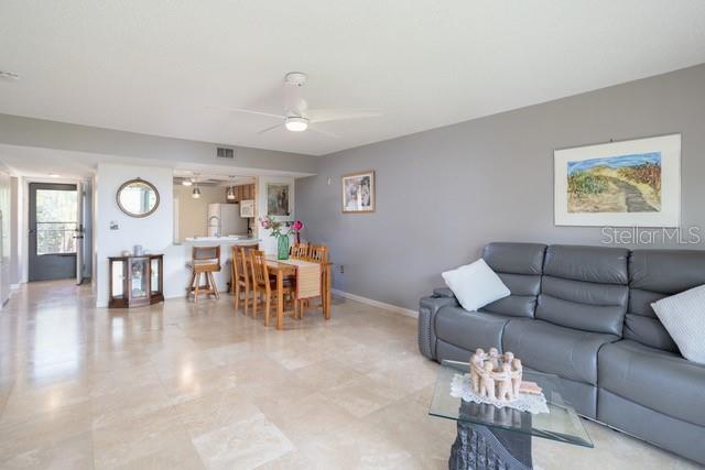 living room featuring ceiling fan