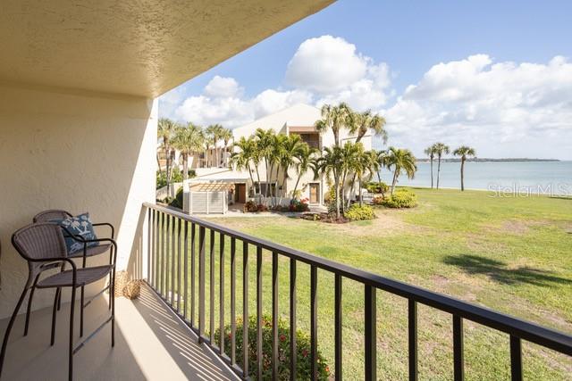 balcony featuring a water view