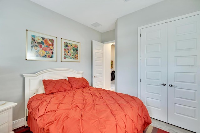 bedroom featuring a closet and light hardwood / wood-style floors