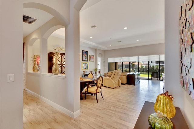 corridor with light hardwood / wood-style flooring