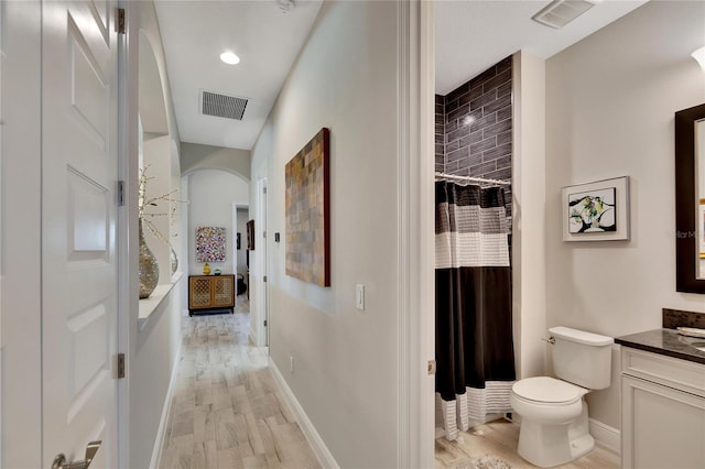 hallway with light hardwood / wood-style floors