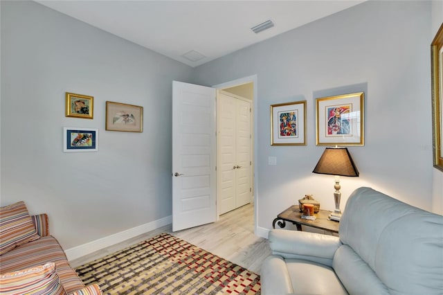 sitting room with light hardwood / wood-style floors