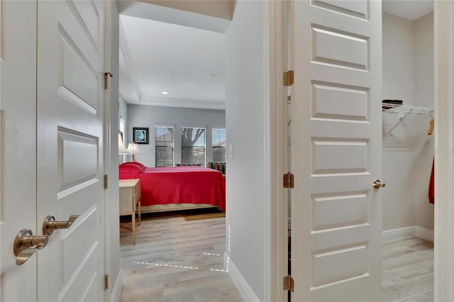 corridor with light hardwood / wood-style flooring