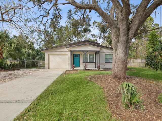 ranch-style house with a garage and a front yard