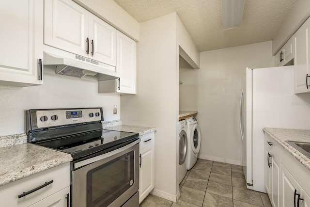 kitchen with under cabinet range hood, white cabinetry, independent washer and dryer, freestanding refrigerator, and stainless steel range with electric stovetop