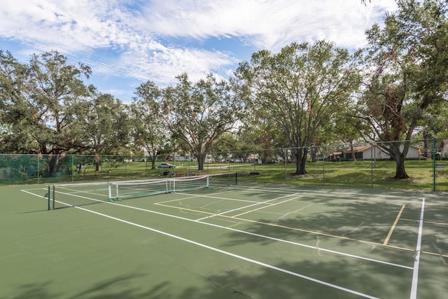 view of tennis court with fence