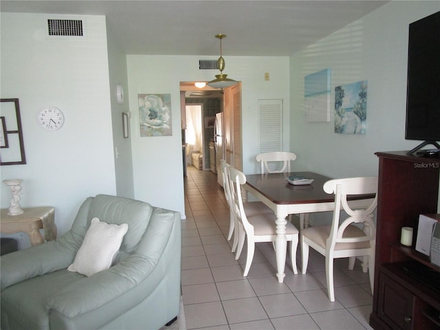 dining room with light tile patterned floors