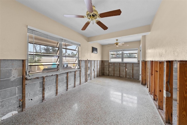 unfurnished room with ceiling fan