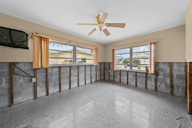 interior space featuring ceiling fan