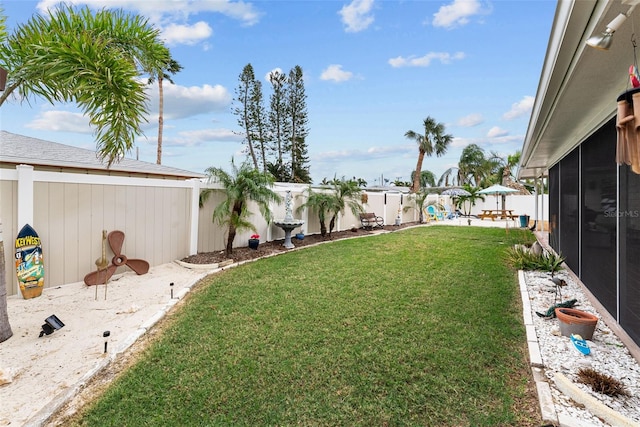 view of yard featuring a sunroom