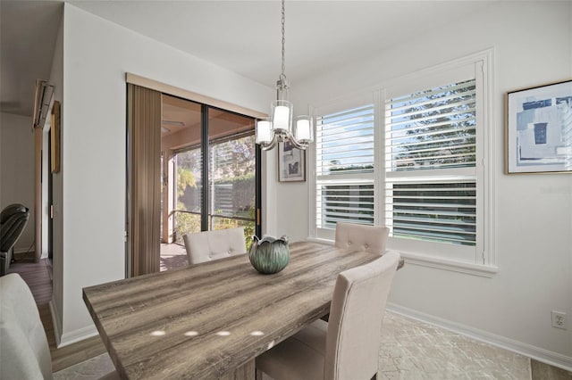 dining space with hardwood / wood-style floors and a wealth of natural light