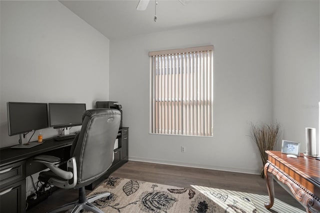 office with dark wood-type flooring and ceiling fan