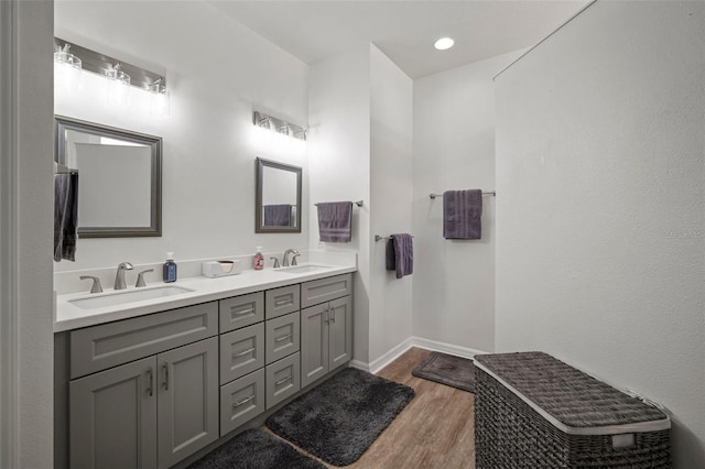 bathroom with vanity and hardwood / wood-style flooring