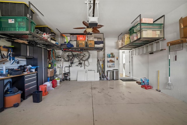 garage featuring ceiling fan and a garage door opener