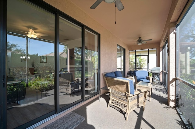 sunroom / solarium featuring ceiling fan