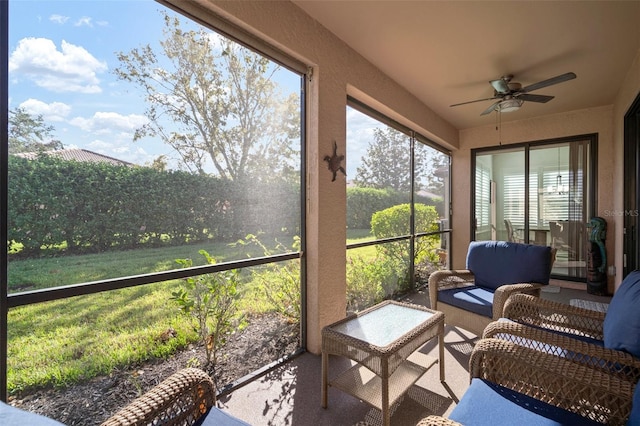 sunroom with ceiling fan