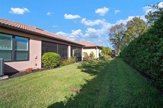 view of yard featuring a sunroom