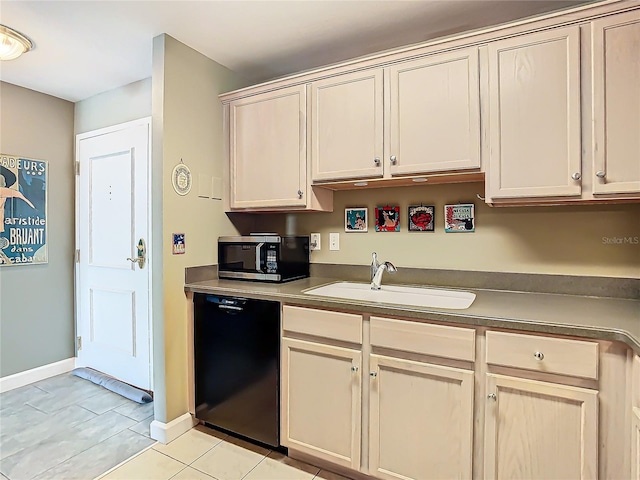 kitchen with light tile patterned floors, black dishwasher, and sink