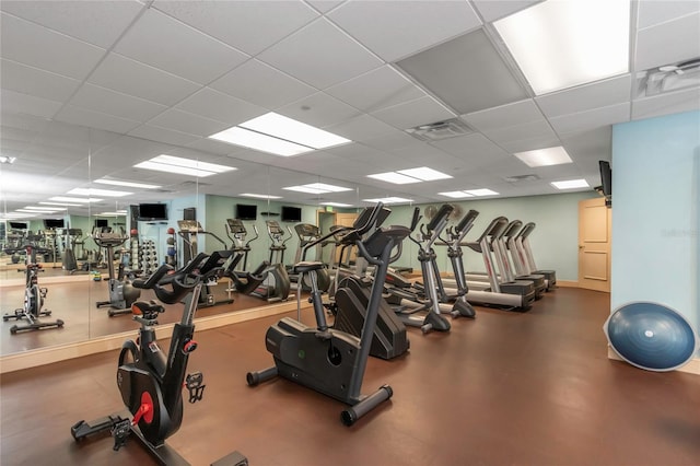 workout area with a paneled ceiling