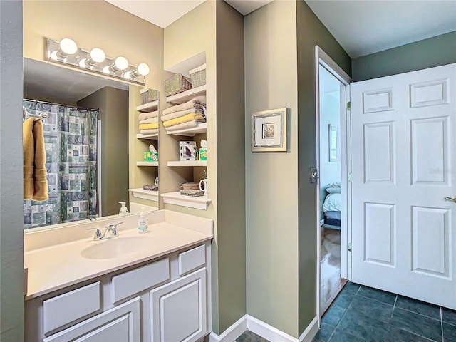 bathroom with tile patterned flooring and vanity