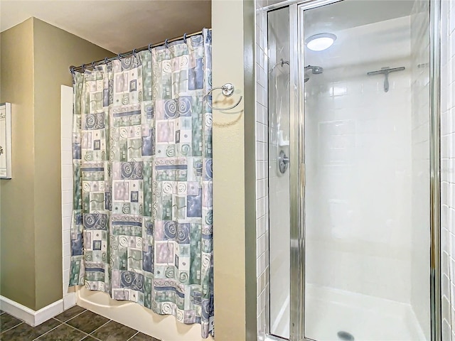 bathroom featuring tile patterned flooring and tiled shower / bath combo