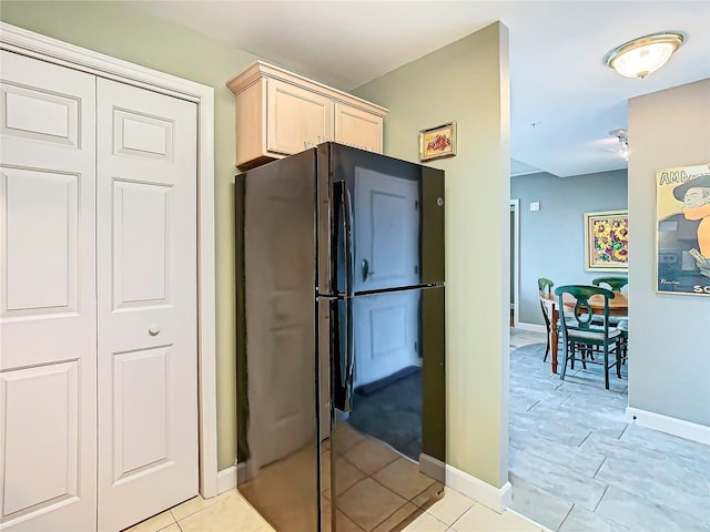 345 Bayshore Blvd Unit 610, Tampa, FL 33606 - kitchen featuring baseboards, light brown cabinets, and freestanding refrigerator
