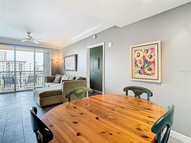 dining room with ceiling fan and crown molding