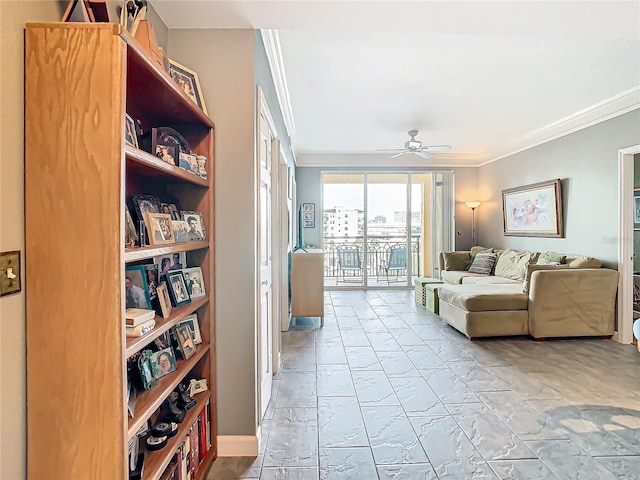 living room featuring ceiling fan and crown molding