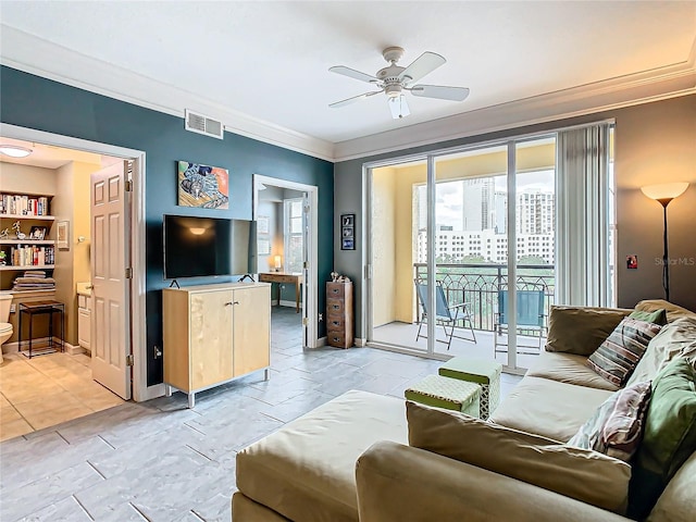 living room featuring ceiling fan and crown molding