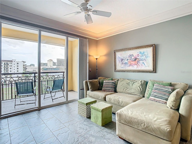 living room featuring ceiling fan and ornamental molding