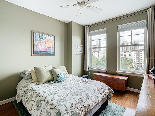 345 Bayshore Blvd Unit 610, Tampa, FL 33606 - bedroom featuring baseboards, wood finished floors, and a ceiling fan