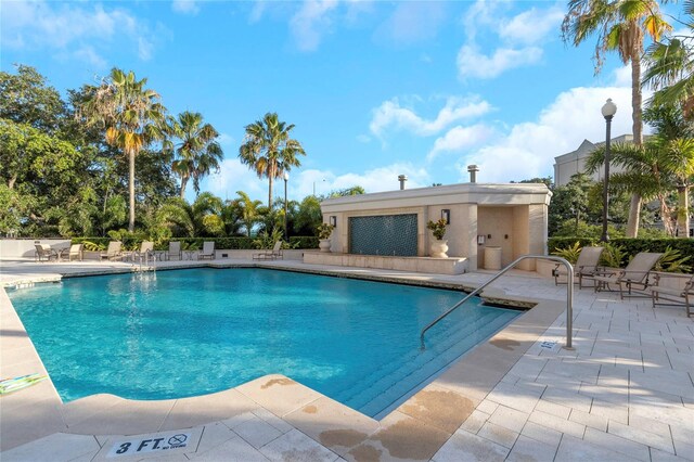 view of swimming pool with a patio