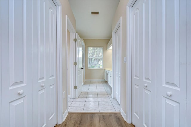 hallway with light wood-type flooring