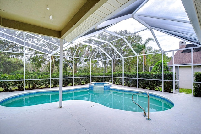 view of pool featuring a patio, a lanai, and an in ground hot tub