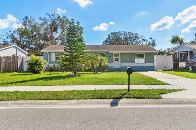 ranch-style home with a front lawn