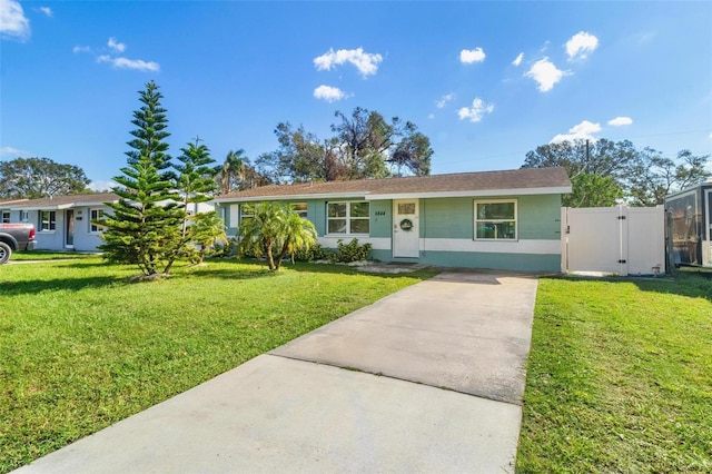 ranch-style home featuring a front yard