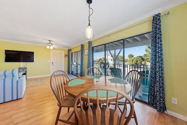 dining room with light hardwood / wood-style floors, ceiling fan, and crown molding