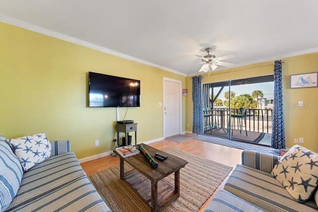 living room with wood-type flooring, ceiling fan, and crown molding