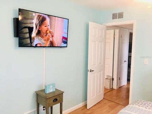 bedroom featuring hardwood / wood-style floors