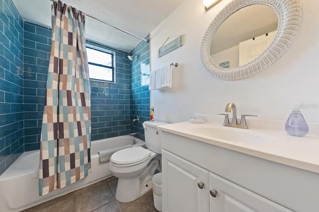 full bathroom featuring a textured ceiling, vanity, shower / bath combo with shower curtain, and toilet