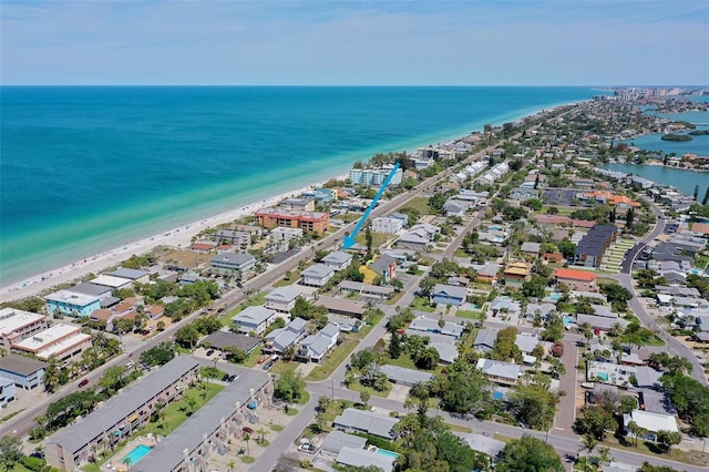 bird's eye view with a water view and a beach view