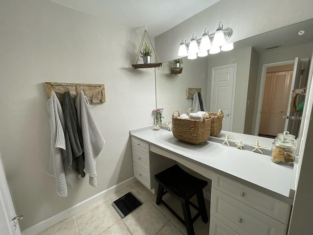 bathroom with vanity and tile patterned flooring